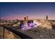 Striking aerial view of the city displaying the downtown buildings against a gorgeous sunset sky at 150 Las Vegas Blvd # 1906, Las Vegas, NV 89101