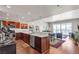 Well-lit kitchen with stainless steel appliances, white countertops, and an adjacent dining/living area at 150 Las Vegas Blvd # 1906, Las Vegas, NV 89101