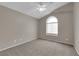 This carpeted bedroom offers natural light from a large window at 1553 Ivygate Ave, Las Vegas, NV 89183