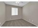 This neutral bedroom offers carpet and a ceiling fan at 1553 Ivygate Ave, Las Vegas, NV 89183