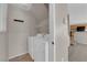 This dedicated laundry room offers a washer and dryer at 1553 Ivygate Ave, Las Vegas, NV 89183