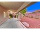 A cozy covered patio with a view of the meticulously maintained desert landscaping at 1643 Silver Slipper Ave, Henderson, NV 89002