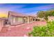 Exterior view of the home showing the covered patio and low maintenance desert landscaping at 1643 Silver Slipper Ave, Henderson, NV 89002
