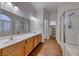 Bathroom boasts double sinks, shower, soaking tub, and access to the walk-in closet at 1643 Silver Slipper Ave, Henderson, NV 89002