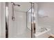 Shower/tub combo in a bathroom with chrome fixtures and bright natural light at 1643 Silver Slipper Ave, Henderson, NV 89002