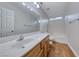 Bathroom featuring a large vanity mirror, wood-look floors, and a shower over tub at 1643 Silver Slipper Ave, Henderson, NV 89002