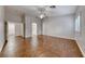 Bright bedroom with wood-look floors, neutral paint, and access to the en suite bathroom at 1643 Silver Slipper Ave, Henderson, NV 89002