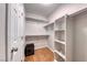 Well-organized walk-in closet with built-in shelving and a door to the bedroom at 1643 Silver Slipper Ave, Henderson, NV 89002