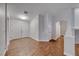 Inviting entryway with wood-look tile flooring, white trim, and a view of the home's interior at 1643 Silver Slipper Ave, Henderson, NV 89002
