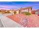 Beautifully landscaped front yard with mature shrubbery, decorative rock stream, and ample street parking at 1643 Silver Slipper Ave, Henderson, NV 89002