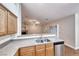 Kitchen sink and stainless dishwasher overlooking open concept living space at 1643 Silver Slipper Ave, Henderson, NV 89002