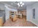 Open kitchen featuring stainless appliances, light wood cabinetry and island at 1643 Silver Slipper Ave, Henderson, NV 89002