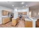 Spacious kitchen with stainless appliances, island, light wood cabinetry, and recessed lighting at 1643 Silver Slipper Ave, Henderson, NV 89002