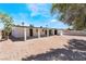 Backyard featuring gravel, privacy fencing, and a covered patio that extends along the back of the house at 1700 Sweeney Ave, Las Vegas, NV 89104
