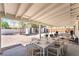 Relaxing covered patio with an outdoor dining area, and furniture for entertaining guests at 1700 Sweeney Ave, Las Vegas, NV 89104