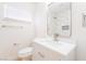 Well lit bathroom with a modern vanity, sleek fixtures, and a shower with stylish tiling at 1700 Sweeney Ave, Las Vegas, NV 89104