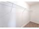 Walk-in closet with ample storage space including a metal rack for hanging clothes at 1700 Sweeney Ave, Las Vegas, NV 89104