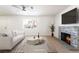 Cozy living area with a stone fireplace, a large window, and neutral tones at 1700 Sweeney Ave, Las Vegas, NV 89104