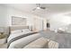 Airy main bedroom with neutral tones, a ceiling fan, and an ensuite bathroom at 1700 Sweeney Ave, Las Vegas, NV 89104