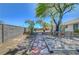 Spacious backyard featuring a stone path, large trees, and wood accents providing a serene outdoor space at 1705 Westwind Rd, Las Vegas, NV 89146