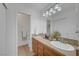 Bathroom featuring dual sinks, granite countertops, and ample cabinet space at 1705 Westwind Rd, Las Vegas, NV 89146