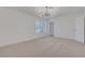 Bright bedroom with modern lighting and carpeted floors offers a serene and inviting space at 1705 Westwind Rd, Las Vegas, NV 89146