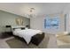 Bedroom with large window, accent wall, and stylish decor at 1705 Westwind Rd, Las Vegas, NV 89146