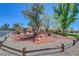 Well-maintained single-story home boasts mature trees, desert landscaping, perfect for enjoying outdoor living at 1705 Westwind Rd, Las Vegas, NV 89146