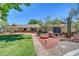 Charming home showcasing xeriscaping, mature trees, and desert landscaping, perfect for enjoying outdoor living at 1705 Westwind Rd, Las Vegas, NV 89146