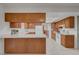 Bright kitchen features wood cabinets, white countertops, tiled floors, and modern appliances at 1705 Westwind Rd, Las Vegas, NV 89146