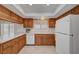 Bright kitchen features wood cabinets, white countertops, tiled floors, and modern appliances at 1705 Westwind Rd, Las Vegas, NV 89146
