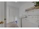 Convenient laundry room featuring modern washer and dryer units and ample storage space at 1705 Westwind Rd, Las Vegas, NV 89146