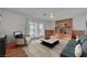 Cozy living area with a fireplace, comfortable seating, and access to the backyard, ideal for entertaining at 1705 Westwind Rd, Las Vegas, NV 89146