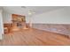 Spacious living room with hardwood floors, brick accents, and plenty of natural light at 1705 Westwind Rd, Las Vegas, NV 89146