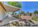 Back patio featuring ample seating and decorative rock landscaping providing relaxing outdoor living at 1705 Westwind Rd, Las Vegas, NV 89146