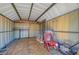 Interior view of a shed with ample storage space, a ladder, and various items at 1705 Westwind Rd, Las Vegas, NV 89146