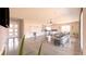 Open-concept living space with hardwood floors, comfortable seating, and seamless flow to the kitchen at 1840 Old West Ave, Pahrump, NV 89048