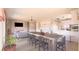 Open-concept living space featuring fireplace, dining area, and modern kitchen with stainless appliances at 1840 Old West Ave, Pahrump, NV 89048