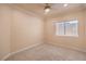 Bedroom featuring carpet flooring, a ceiling fan, a window with blinds, and neutral colored walls at 1869 Desert Forest Way, Henderson, NV 89012
