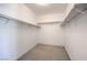 Walk in closet with carpet flooring and shelving at 1869 Desert Forest Way, Henderson, NV 89012