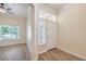 Bright entryway featuring hardwood floors, high ceilings, and a large window at 1869 Desert Forest Way, Henderson, NV 89012