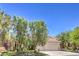 Charming single-story home with a three-car garage, mature trees and well-manicured landscaping at 1869 Desert Forest Way, Henderson, NV 89012