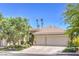Charming single-story home with a three-car garage, mature trees and well-manicured landscaping at 1869 Desert Forest Way, Henderson, NV 89012
