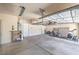 Spacious garage providing ample storage space, a bike, and a treadmill for exercise at 1869 Desert Forest Way, Henderson, NV 89012
