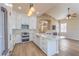 Stylish, modern kitchen offers white cabinetry, quartz countertops, and premium stainless steel appliances at 1869 Desert Forest Way, Henderson, NV 89012