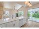 Bright kitchen featuring modern appliances and direct access to the outdoor patio area at 1869 Desert Forest Way, Henderson, NV 89012