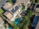 Aerial view of the home showcasing the pool, solar panels, and outdoor living spaces at 1870 Desert Forest Way, Henderson, NV 89012