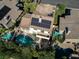 Aerial view of home showcasing the pool, solar panels, patio, and well-manicured yard in a desirable neighborhood at 1870 Desert Forest Way, Henderson, NV 89012