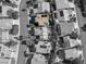 Highlighted aerial view of a home with a private pool, mature trees, and well-maintained landscaping at 1870 Desert Forest Way, Henderson, NV 89012