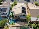Overhead view of a property featuring a swimming pool, patio, and well-maintained yard within a residential neighborhood at 1870 Desert Forest Way, Henderson, NV 89012
